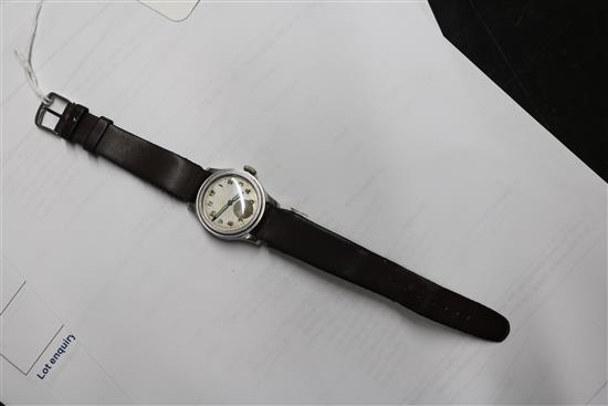 A mid 20th century stainless steel Longines mid size? manual wind wrist watch retailed by J.W. Benson,